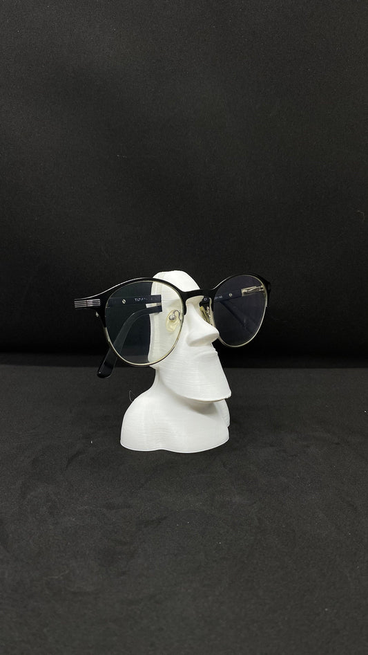 3D printed Moai glasses holder on desk